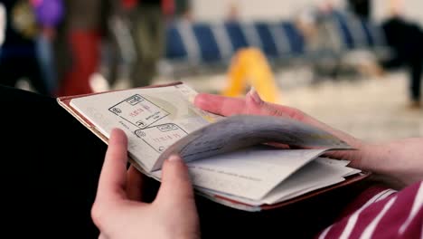 Passport.-The-girl-turns-over-the-passport-at-the-airport