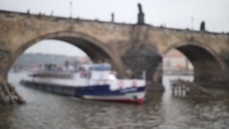 The-ship-sails-under-the-Charles-Bridge.-4K-Slow-Mo