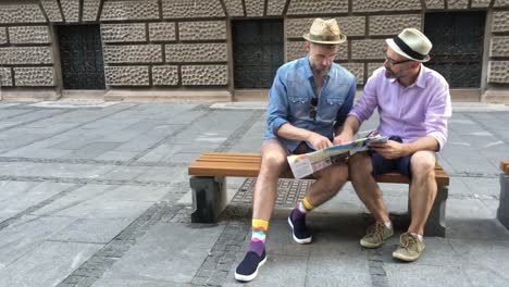 Gay-couple-exploring-a-city-in-Europe