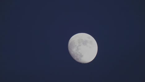 twin-engine-plane-flies-across-moon-telephoto