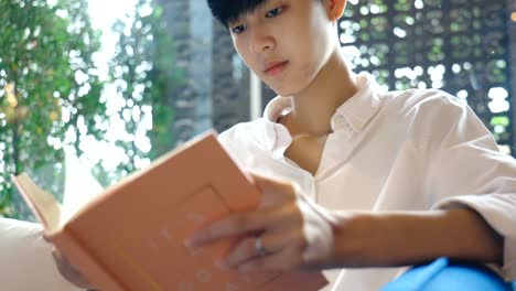 Close-up-Young-Asian-woman-reading-a-book