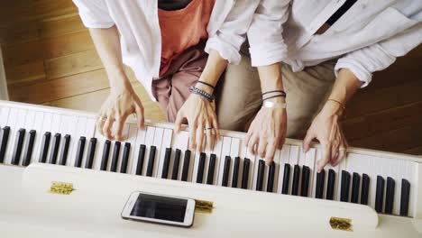 Girlfriends-playing-on-piano