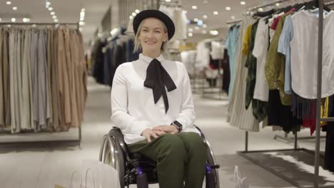 Happy-Woman-in-Wheelchair-Posing-in-Clothing-Store