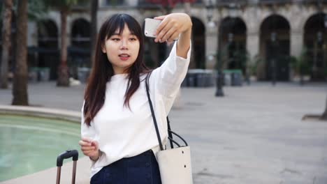 chinese-female-tourist-making-selfie