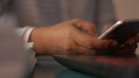 Close-up-woman-hands-texting-message-on-mobile-smart-phone-for-communication.