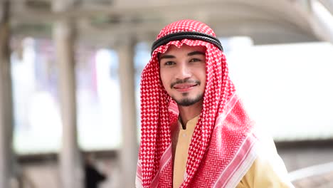 Islamic-arab-man-wear-hijab-and-muslim-formal-dress-multicultural-diversity-business-people-smiling-look-at-camera-in-modern-cityscape.