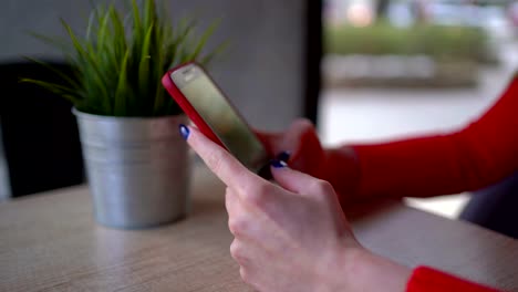 Close-up-of-woman-hand-using-mobile-phone