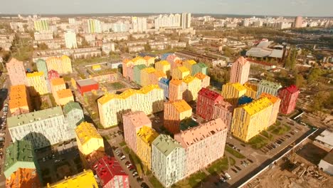 Panorama-cozy-comfortable-colorful-buildings-in-a-European-city-4K-UHD-aerial