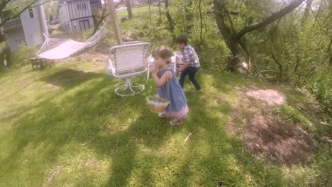 POV-of-a-parent-following-their-two-young-children-on-a-Easter-egg-hunt