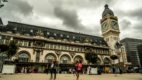 People-walking-across-square-in-front-of-entrances-to-Lyon-railway-terminal