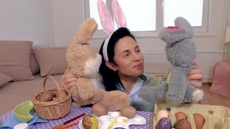 Woman-plays-with-toy-bunnies