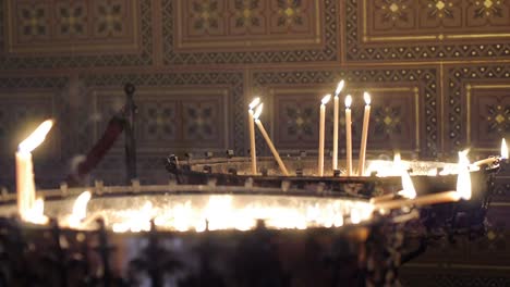 Sacrificial-or-memorial-candles-lit-in-a-church.