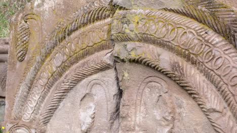 Ancient-bas-relief-caucasus-old-carved-stones-in-rock-cut-cave-monastery-Vardzia,-excavated-from-the-slopes-of-the-Erusheti-Mountain,-Samtskhe-Javakheti,-Georgia