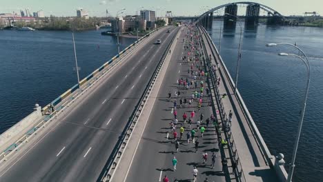 4K-Aerial-drone-fooage.-Marathon-running-on-the-bridge.