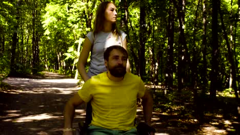 Young-disable-man-in-the-park-with-his-wife