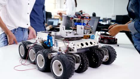 Close-up-Car-Robot-on-the-desk.-People-develop-robot-at-laboratory.