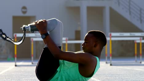 Disabled-athletic-exercising-on-a-running-track-4k