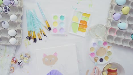 Little-girl-and-her-mom-painting-Easter