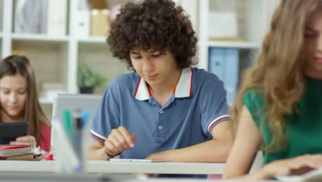 Group-of-Teenagers-Using-Tablets