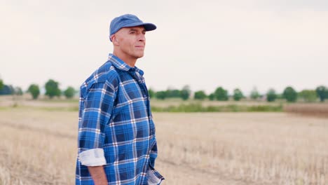 Modern-Farming.-Love-of-Agriculture.-Farmer-using-digital-tablet-while-examining-farm