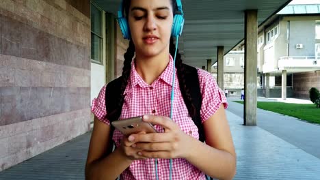 Girl-listening-music-from-smart-phone-mp3-player