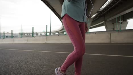 Woman-Walking-on-Bridge-and-Enjoying-Music