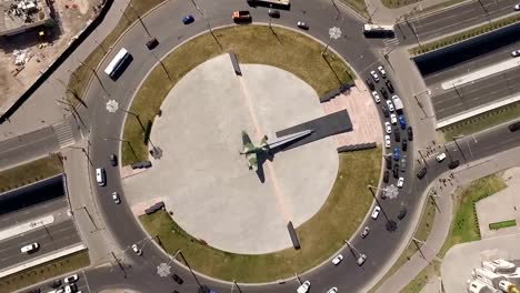 aerial-view-of-cars-are-moving-on-round-intersection-in-city-in-summer-day