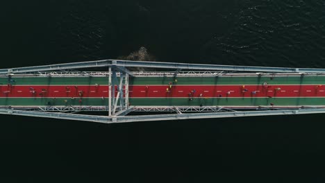 Marathon-running-on-the-footbridge.-Top-view-shot