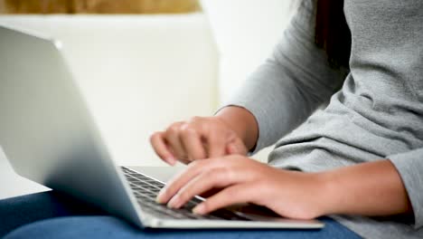 Asian-woman-using-tablet-computer-shopping-online-website-on-smartphone-with-smiling-face.-Happiness-asian-woman-holding-cellphone-checking-mail-from-online-shopping-website-read-article-Blog-vlog-social-media