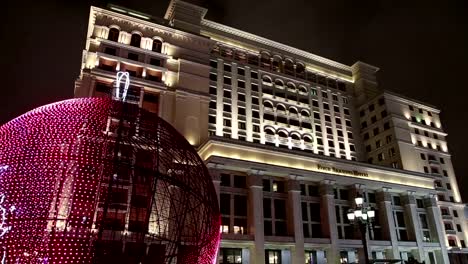 Christmas-and-New-Year-holidays-illumination-and-old-Hotel-Moskva-from-Manege-Square-at-night.-Moscow,-Russia