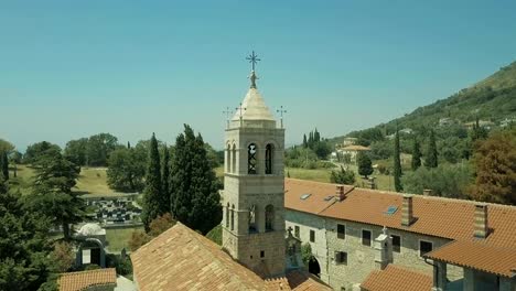 High-tower-of-fortress-towers-above-green-fields-in-sunny-weather