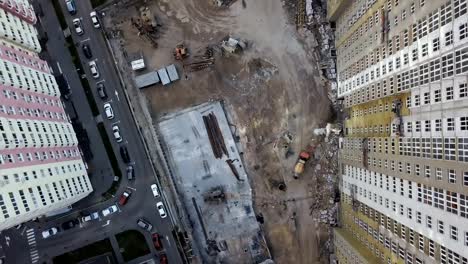 Aerial-view.-Urban-area-in-the-metropolis.-Construction-of-high-rise-residential-apartments-in-the-city.-View-of-the-building-site-from-above.-Sale-and-rental-of-residential-property