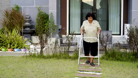 senior-woman-walking-with-walker-at-home