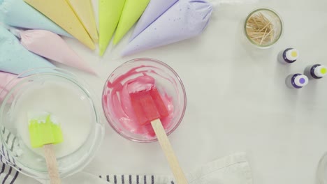 Mixing-royal-icing-to-decorate-Easter-sugar-cookies.