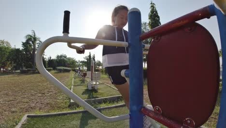 Asian-women-are-exercising-outdoors-with-exercise-machines.-concept-of-losing-weight-with-exercise-for-health.