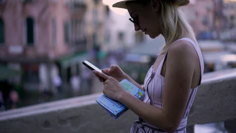 Slow-motion-effect-of-positive-female-tourist-with-cellphone-in-hand