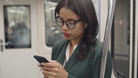 Woman-Travelling-by-Subway-Car