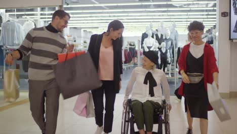 Woman-with-Disability-Shopping-in-Mall-with-Friends