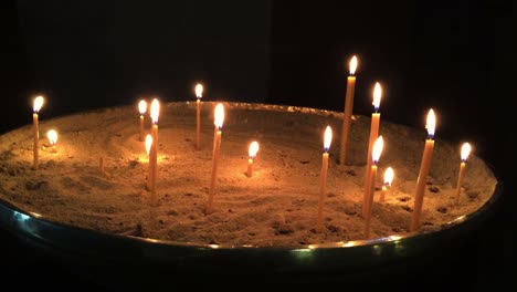 Many-candles-burning-in-church.