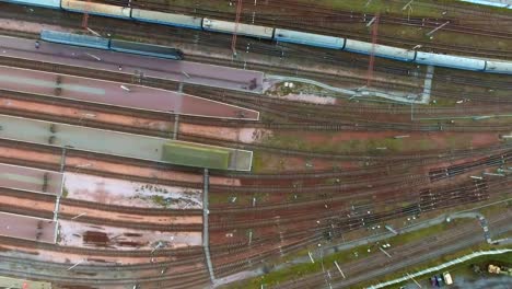 Aerial-view.-Trains-moving-out-from-platform-of-railway-station-Kiev,-Ukraine