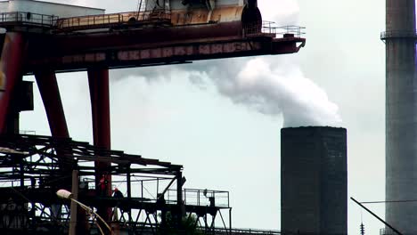 Two-people-working-at-height-on-a-background-of-white-smoke