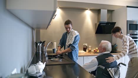 Social-Worker-Helping-Elderly-Man-with-Housework