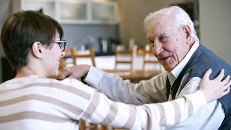 Young-Woman-Talking-with-Elderly-Man