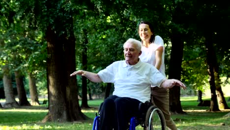 Granddaughter,-nurse,-caring-for-the-elderly,-girl-(woman),-grandfather,-happy,-freedom,-running-around-in-the-park.