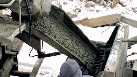 Cement-on-the-troughs-follows-from-the-concrete-mixer.-Construction-site