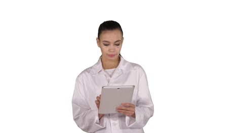 Doctor-using-tablet-while-walking-on-white-background