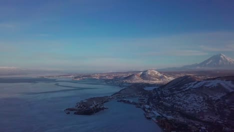 Aerial-view-of-Kamchatka-biggest-city-of-Petropavlosk,-volcanos-and-city