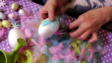 Woman-with-Easter-decoration-egg-and-feather