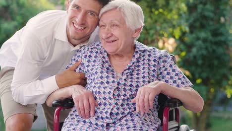 Portrait-of-an-elderly-woman.-The-elderly-person-in-the-nursing-home-and-the-green-of-the-trees-in-the-background.