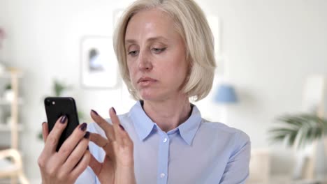 Portrait-of-Old-Senior-Woman-Busy-Using-Smartphone